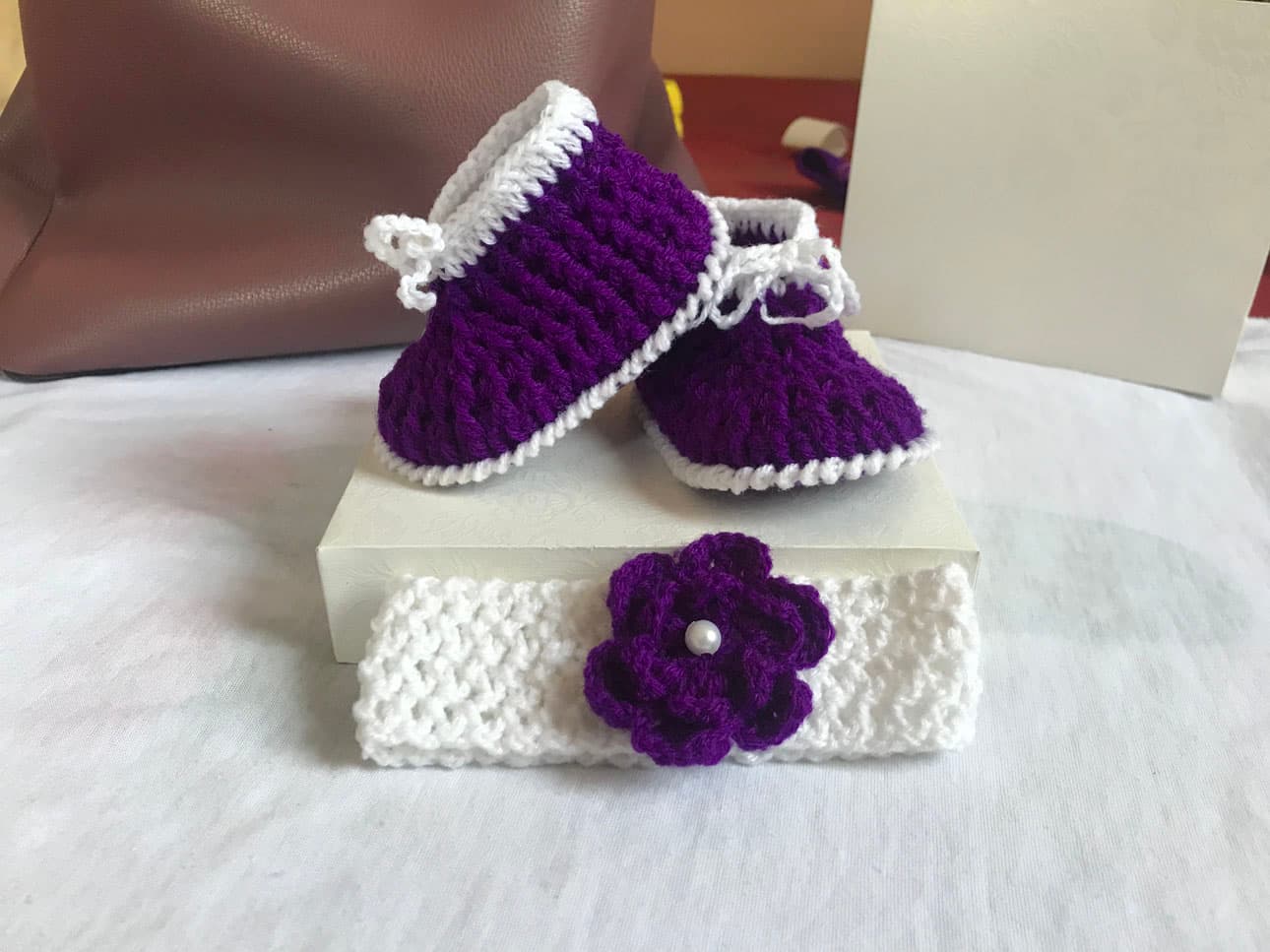 Purple and white crochet shoes for babies