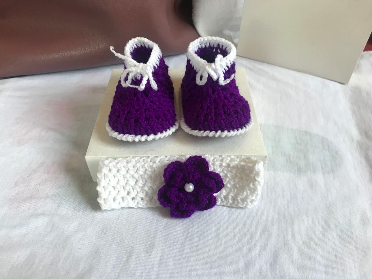 Purple and white crochet shoes for babies