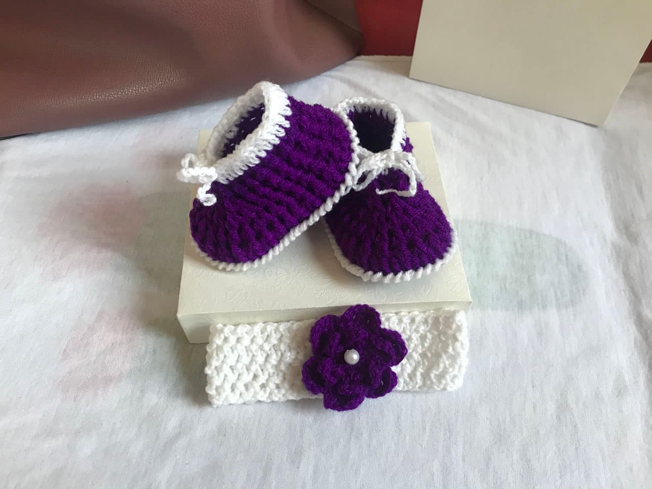 Purple and white crochet shoes for babies