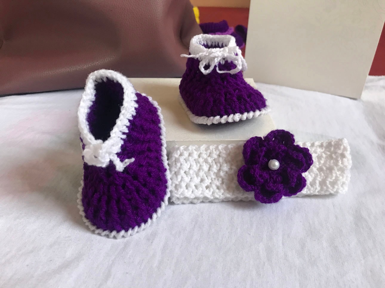 Purple and white crochet shoes for babies