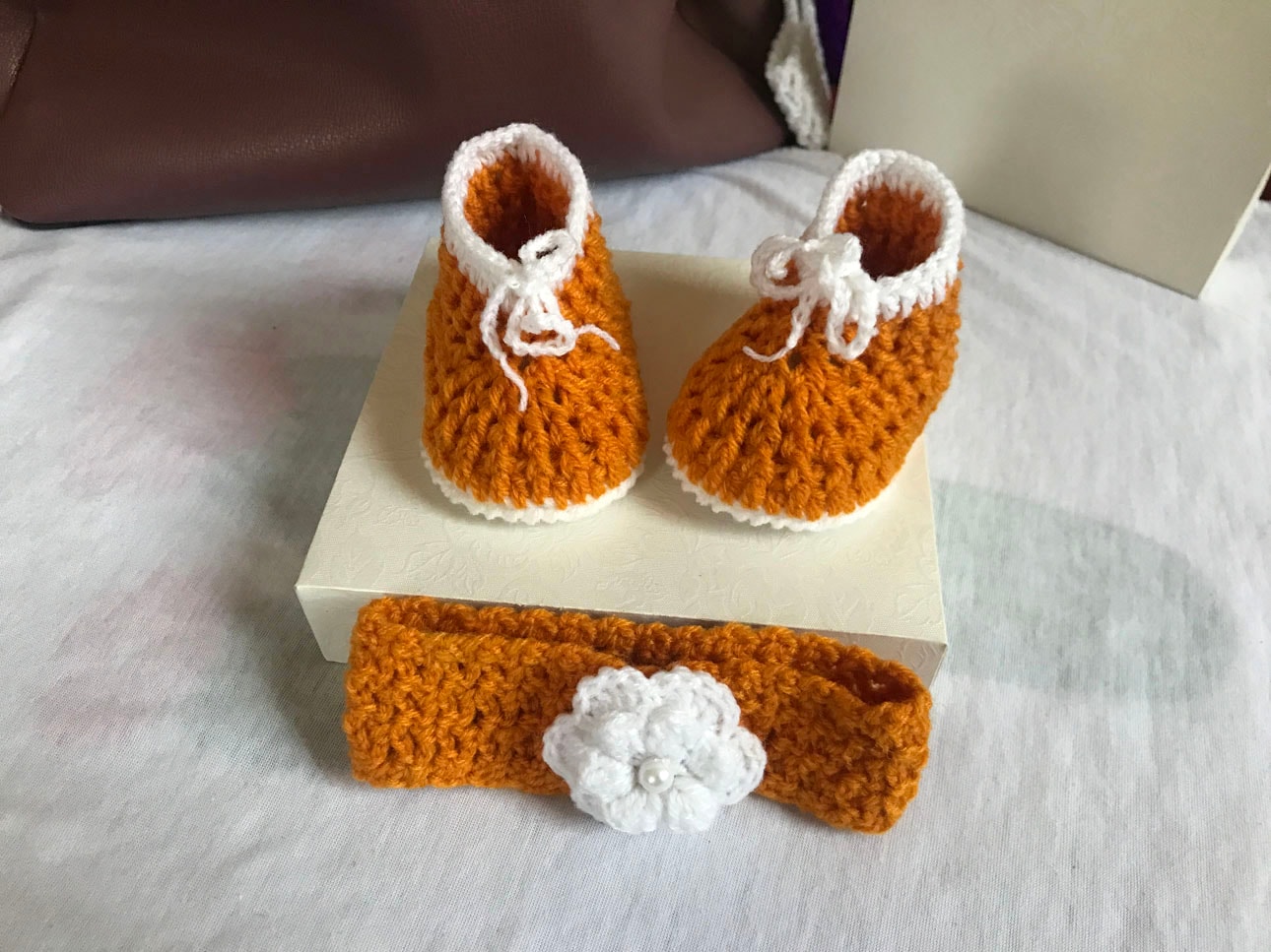 Gold and white crochet shoes for babies