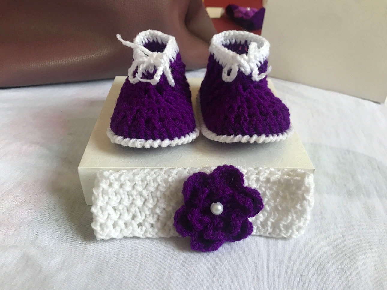 Purple and white crochet shoes for babies